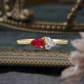 Pear Shaped Ruby Promise Wedding Band Ring with Three Round Stone