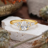 3 Prong Classic Pear Cut Side Stone Moissanite Engagement Ring