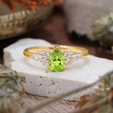 3 Prong Classic Pear Cut Side Stone Peridot Engagement Ring