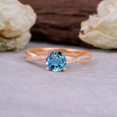 Classic Round Cut Aquamarine Engagement Ring with Twisted Band