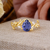 4 Prong Nature Inspired Pear Cut Tanzanite Leaf Gold Engagement Ring