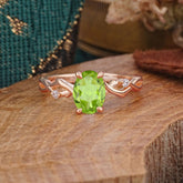 Artistic Twisted Shank Oval Cut Peridot Engagement Ring