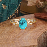 Artistic Twisted Shank Oval Cut Turquoise Engagement Ring