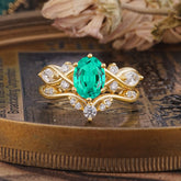 The Sumptuous Oval - Cut Emerald Halo Ring