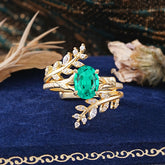Delicate Leaf Embellished 4 - Prong Oval - Cut Emerald Ring Sets