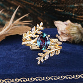Delicate Leaf Embellished 4 - Prong Oval - Cut Alexandrite Ring Sets