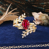 Delicate Leaf Embellished 4 - Prong Oval - Cut Ruby Ring Sets