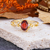 Nature-Inspired Branch-Wrapped 4-Prong Oval Garnet Engagement Rings