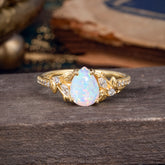 Nature-Inspired Classic Luxe 4-Prong Pear-Cut Opal Engagement Ring
