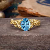 Nature-inspired Botanical Vine Entwined 4-Prong Oval-Cut Aquamarine Engagement Ring
