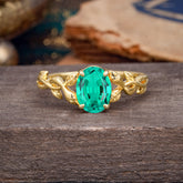Nature-inspired Botanical Vine Entwined 4-Prong Oval-Cut Emerald Engagement Ring