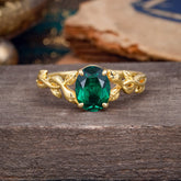 Nature-inspired Botanical Vine Entwined 4-Prong Oval-Cut Emerald Engagement Ring