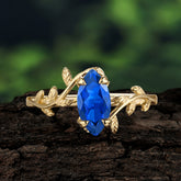 Nature-Inspired Leafy Branch 4-Prong Marquise Sapphire Engagement Ring