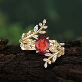 Delicate Leaf Embellished 4 - Prong Oval - Cut Garnet Ring Sets