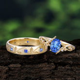 Nature-Inspired Branch-Wrapped 4-Prong Oval Sapphire Engagement Couple Rings