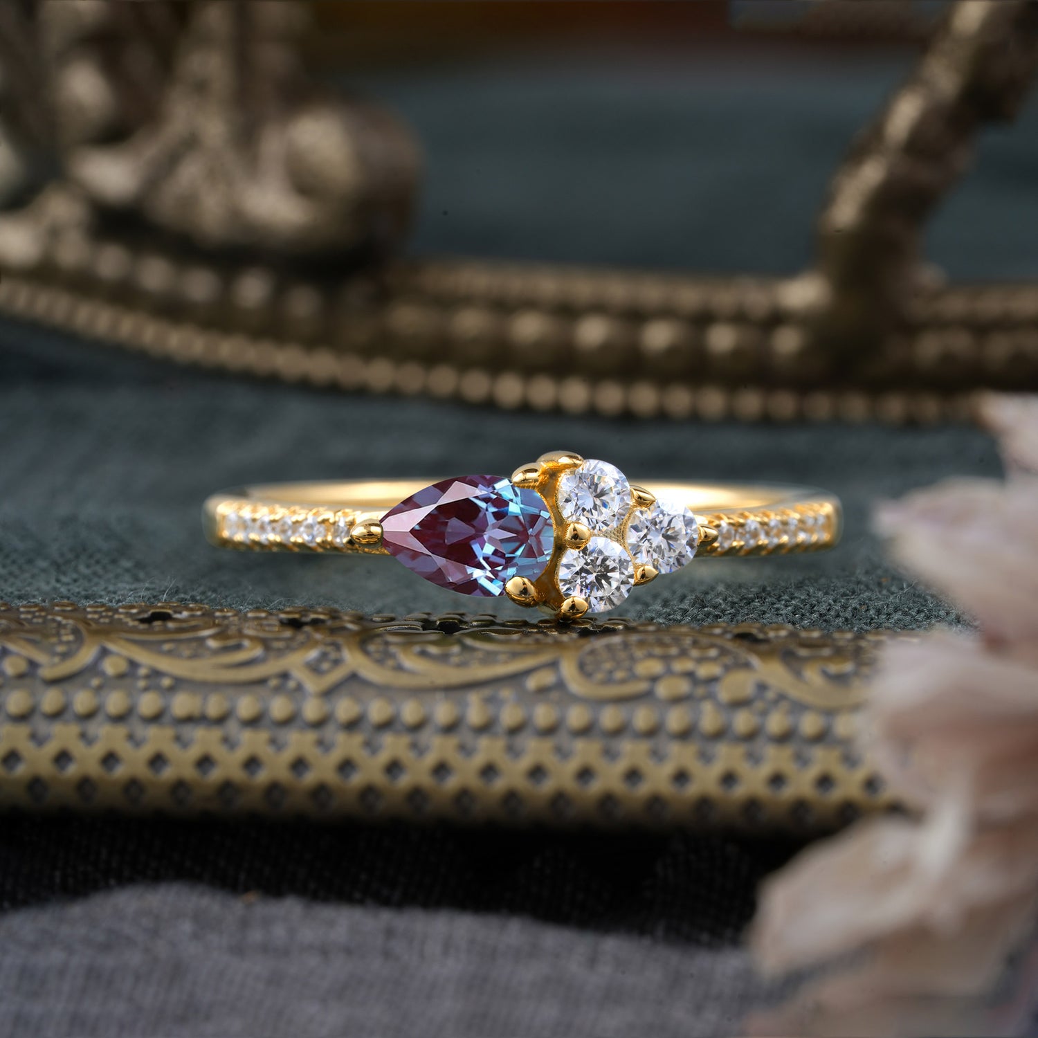 Pear Shaped Alexandrite Three Round Stone Engagement Ring