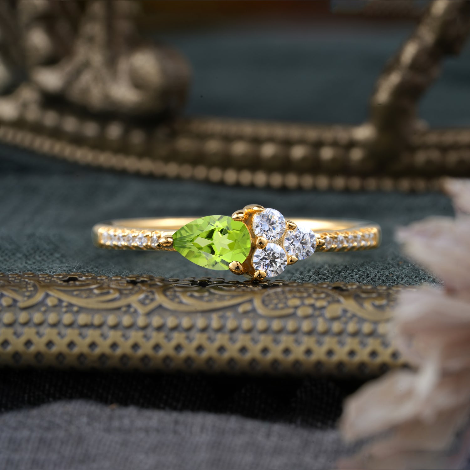 3 Prong Pear Shaped Peridot Three Round Stone Engagement Ring