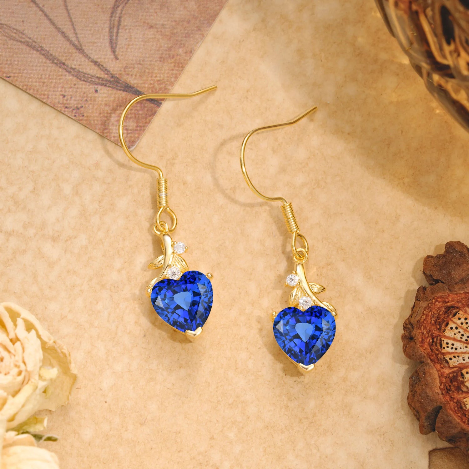 Elegant Heart Shape Sapphire Drop Earrings in Gold with Delicate Leaf Accent