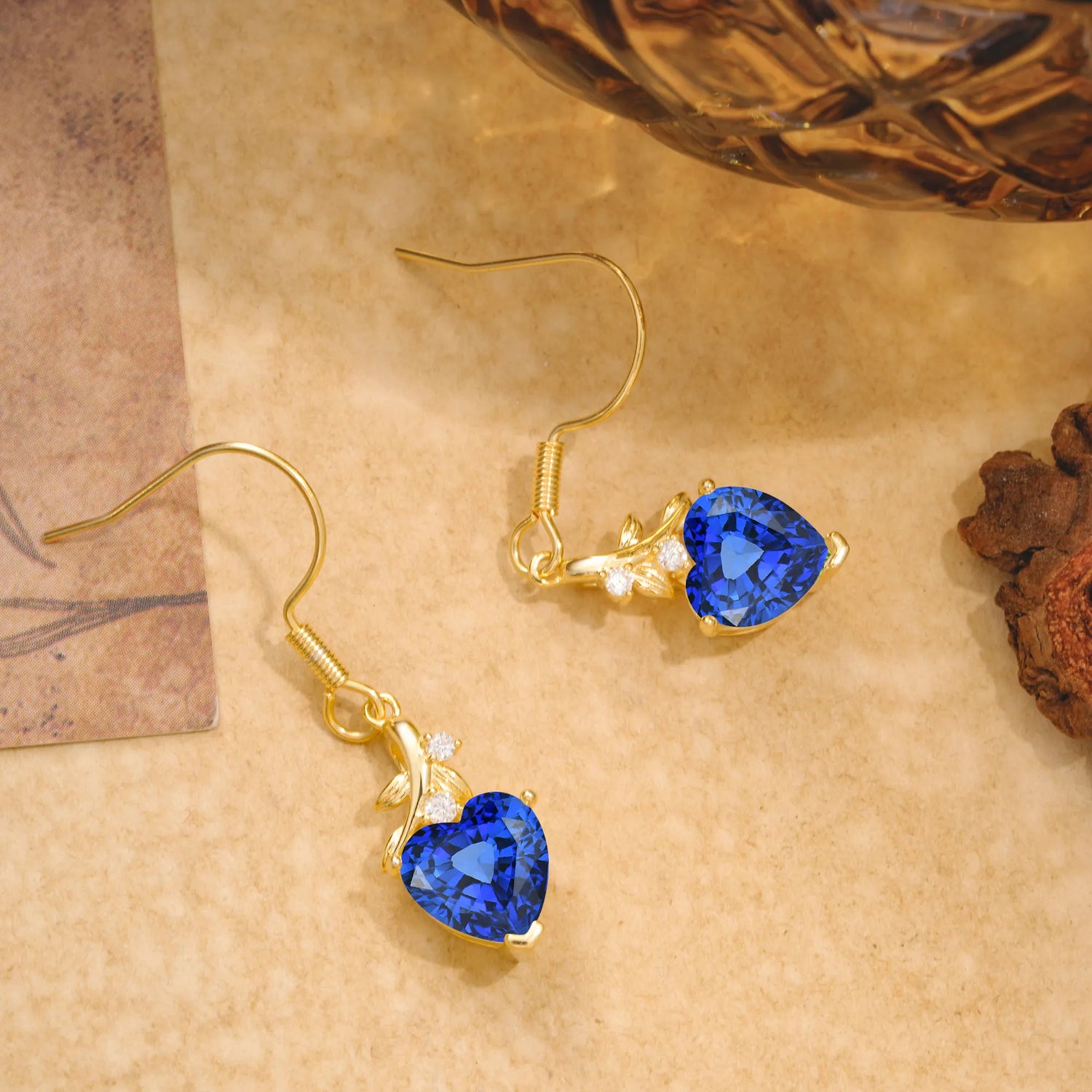 Elegant Heart Shape Sapphire Drop Earrings in Gold with Delicate Leaf Accent