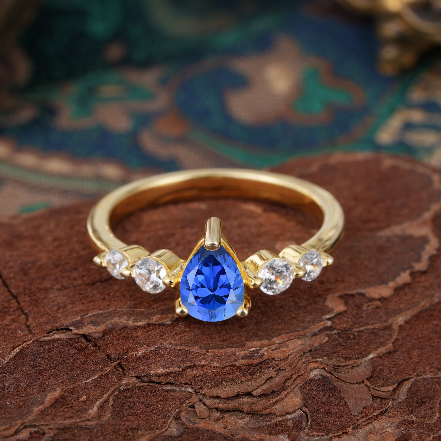 Pear Cut Classic Sapphire Side Stone Engagement Ring