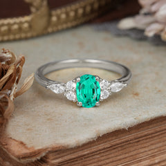 Oval Cut Emerald Classic Side Stone Engagement Ring