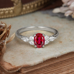 Oval Cut 4 Prong Ruby Classic Side Stone Engagement Ring