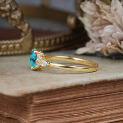 Oval Cut 4 Prong Turquoise Classic Side Stone Engagement Ring