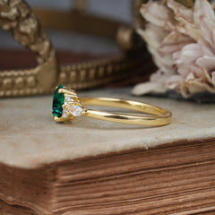 Oval Cut Emerald Classic Side Stone Engagement Ring