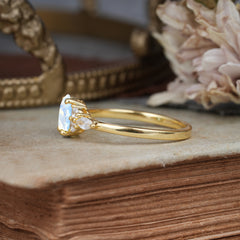 Oval Cut 4 Prong Moonstone Classic Side Stone Engagement Ring