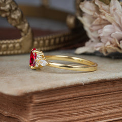 Oval Cut 4 Prong Ruby Classic Side Stone Engagement Ring