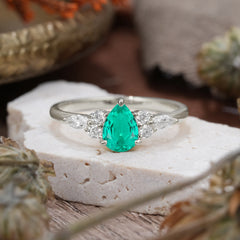 3 Prong Classic Pear Cut Side Stone Emerald Engagement Ring