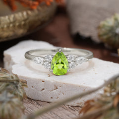 3 Prong Classic Pear Cut Side Stone Peridot Engagement Ring