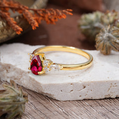 3 Prong Classic Pear Cut Side Stone Ruby Engagement Ring