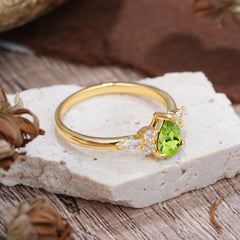 3 Prong Classic Pear Cut Side Stone Peridot Engagement Ring