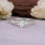Classic Round Cut Lab Diamond Engagement Ring with Twisted Band on a soft background with flowers.