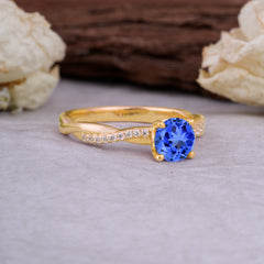 Classic Round Cut Sapphire Engagement Ring with Twisted Band