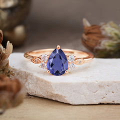 3 Prong Pear Cut Classic Lab Grown Tanzanite Engagement Ring with Side Stone