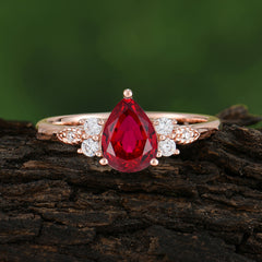 Pear Cut Classic Ruby Engagement Ring with Side Stone