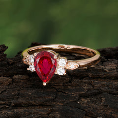 Pear Cut Classic Ruby Engagement Ring with Side Stone