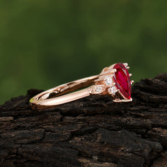 Pear Cut Classic Ruby Engagement Ring with Side Stone