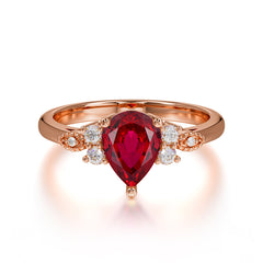 Pear Cut Classic Ruby Engagement Ring with Side Stone