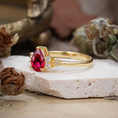 Pear Cut Classic Ruby Engagement Ring with Side Stone
