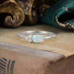 Oval Cut Opal Ring 0.5ct with Side Stone Delicate Design