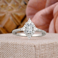 Vintage 4 Prong Oval Cut  Lab Diamond Engagement Ring Cluster Pave Bridal Ring on display with floral background.