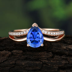 Contemporary 3-Prong Pear Cut Sapphire Ring