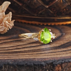 Nature-Inspired Pear-Shaped Classic Peridot Ring for Engagement and Weddings