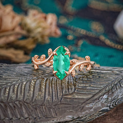 Nature-Inspired Leafy Branch 4-Prong Marquise Emerald Engagement Ring