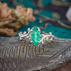 Nature-Inspired Leafy Branch 4-Prong Marquise Emerald Engagement Ring