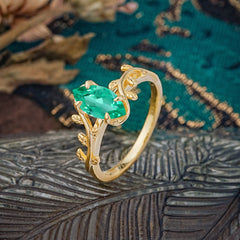 Nature-Inspired Leafy Branch 4-Prong Marquise Emerald Engagement Ring