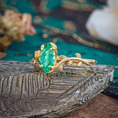 Nature-Inspired Leafy Branch 4-Prong Marquise Emerald Engagement Ring